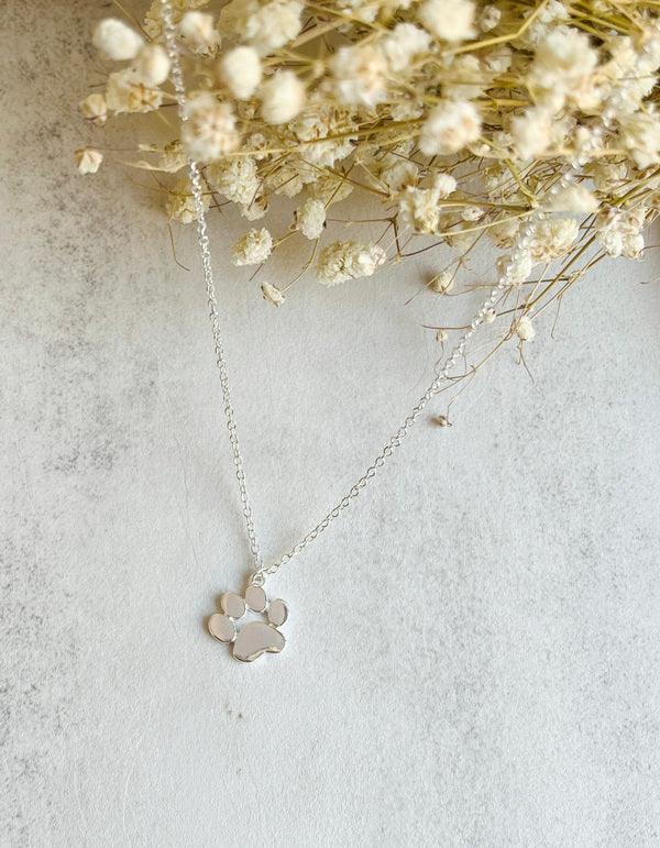 Elegant silver paw print pendant necklace
