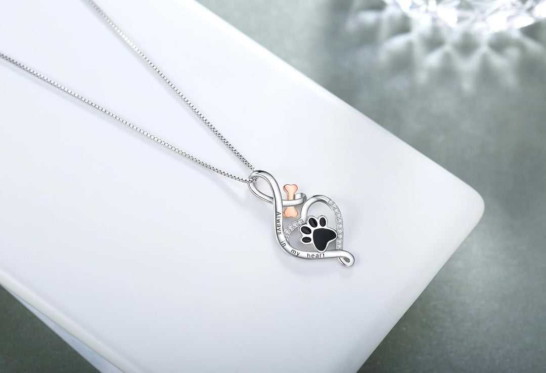 Lucky paw necklace with heart, bone, and infinity symbol