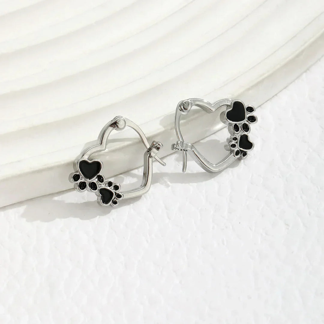 Huggie earrings with a heart and black enamel