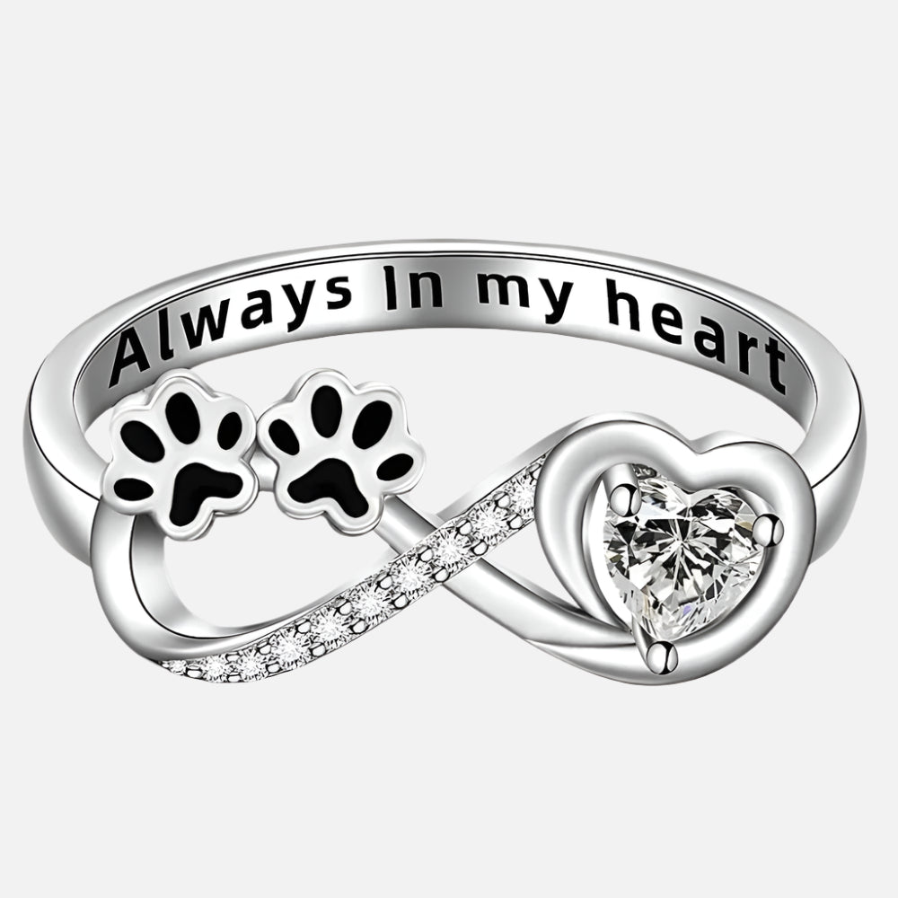 Ring with paw-shaped zirconia, heart, and infinity symbol