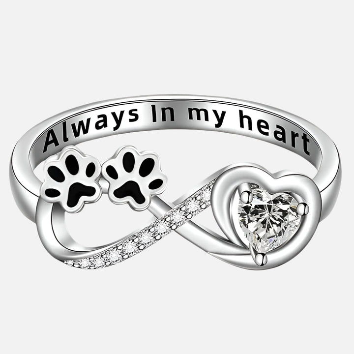 Ring with paw-shaped zirconia, heart, and infinity symbol