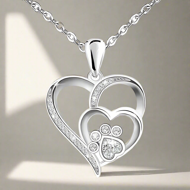 Sterling silver paw print and heart necklace, set with zirconia
