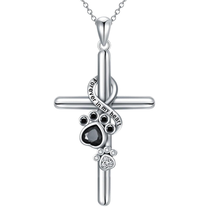 Silver paw print and cross pendant